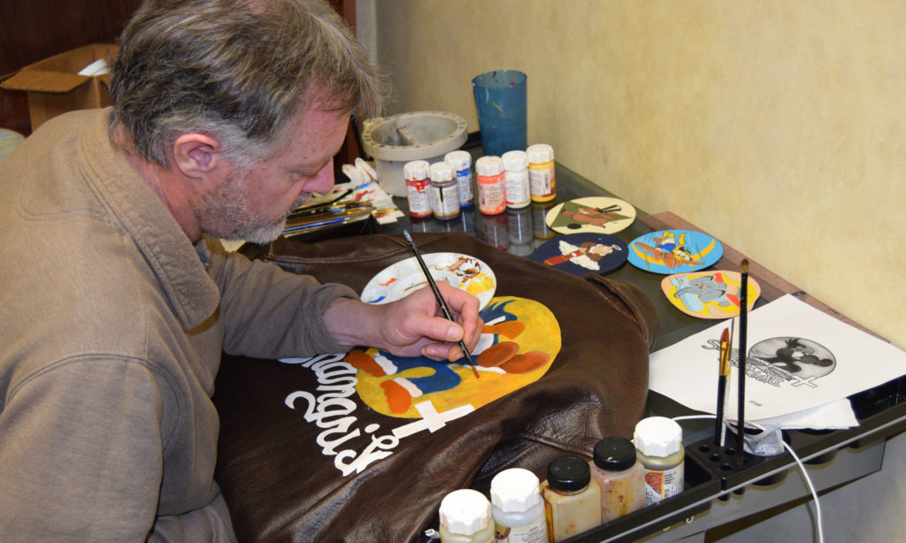 Jim Harley painting in his studio