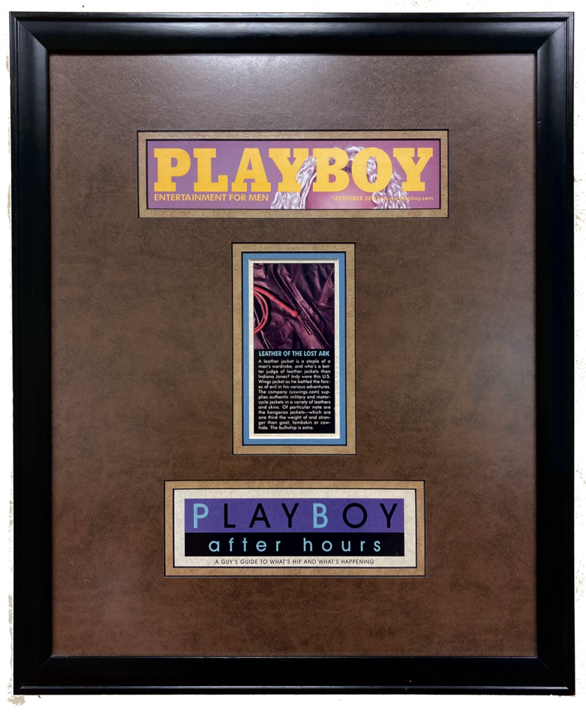 a framed playboy article saying the us wings indiana jones jacket is in style